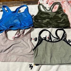 4 PINK Sports Bras. All different colors.